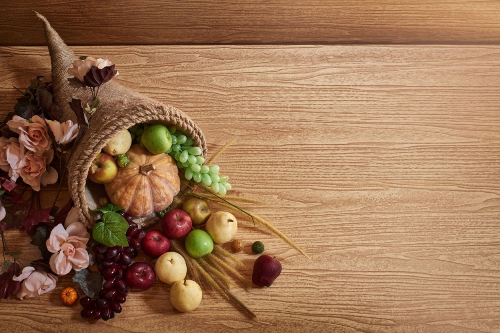 Cornucopia with fruits, vegetables and flowers
