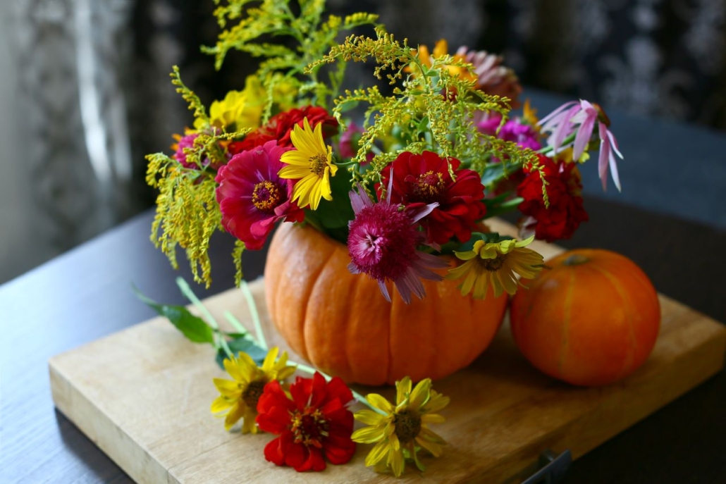 Fall flowers potted into a pumpkin