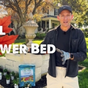 Kaleb Wyse in front of a flower bed